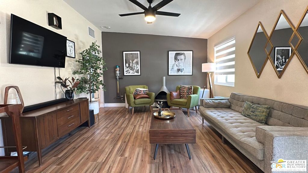 This gorgeous mid-century pool home that perfectly blends classic charm with modern upgrades is available for lease. Located in Cathedral City near the Palm Springs airport and just minutes from the 10 freeway, it offers both style and convenience. Step inside to find an inviting, light-filled layout featuring quartz countertops, stainless steel appliances, recessed lighting, and stylish designer paint and fixtures. The spacious family room is enhanced by natural light and new ceiling fans, creating a warm, comfortable atmosphere. Outside, the expansive backyard is a true highlight complete with a sparkling pool, mature landscaping, and ample space to relax, entertain, or enjoy quiet desert evenings.