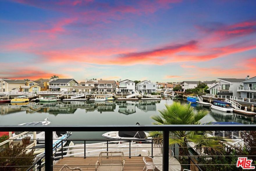 Modern Waterfront Oasis with Private Dock in Channel Islands Harbor! Welcome to your dream coastal rental an impeccably remodeled 4-bedroom, 3-bath Mandalay Bay waterfront home, nestled at the end of the channel with exceptional privacy and panoramic water views. Offering over 2,400 square feet of refined living space, this east/west-facing home is ideal for those seeking style, space, and seamless indoor-outdoor living. Enjoy the convenience of your private dock perfect for vessels up to 40' and a newly built waterside deck ideal for sunset lounging or entertaining guests. The interior boasts vaulted ceilings, wide plank oak floors, and a striking dual-sided fireplace that connects the living and dining rooms, all drenched in natural light. The gourmet kitchen is a chef's delight, featuring custom wood and cane cabinetry, high-end appliances, quartz countertops, and handcrafted tile backsplash. For those who love to cook or entertain, a full secondary kitchen functions as a chef's kitchen, prep kitchen, or catering space perfect for hosting large gatherings or preparing multi-course meals with ease. Upstairs, you'll find all four bedrooms, including the waterside primary suite with private balcony, spa-like bath, soaking tub, and a walk-in marble shower. Additional highlights include custom 12' bi-fold doors, designer finishes throughout, steel cable railings, upgraded windows and doors, new oak gates, recessed lighting, and more. Located just minutes from Seabridge Marina, beaches, shops, and restaurants, this home is the perfect blend of luxury and laid-back coastal living. Available furnished or unfurnished.