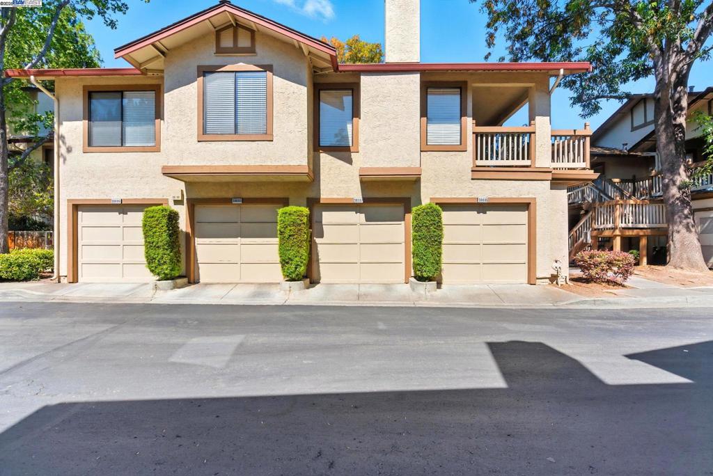 This stunning, bright condo in the Orchards offers charm and comfort. It features two spacious bedrooms, including a primary suite and a second bedroom suite, both with modern bathrooms and ample closet space. The kitchen is equipped with sleek granite countertops and a refrigerator with water and ice hookups. The dining area, conveniently located off the kitchen, boasts plenty of natural light and views of the complex grounds. The living room is cozy with a wood-burning fireplace and direct access to the private patio deck. The condo also offers plenty of storage throughout the interior. Laundry area with a washer and dryer located in the garage. The HOA covers earthquake insurance for added peace of mind.