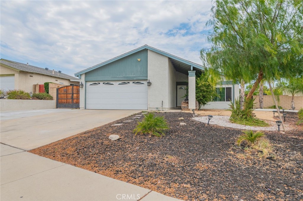 A Wonderful North Corona Neighborhood! Four Bedroom Two Bathroom. Master Bedroom with private 3/4 Bathroom, Walk-in-closet and an additional closet. Large Living Room with Fireplace and Vaulted Ceilings. Laminate Flooring and Dual Pane Windows Throughout. Fairly new Roof. Two Car Garage with direct access and Laundry area in Garage. HUGE LOT; 12,197 SQ FT - A MUST SEE BACKYARD: PERFECT FOR ENTERTAINMENT; REGULAR LARGE PATIO, AN ADDITIONAL ALUMAWOOD PATIO WITH BARBECUE AREA AND A LARGE COUNTER TOP. Also, large RV ACCESS. Block Wall throughout the entire yar.