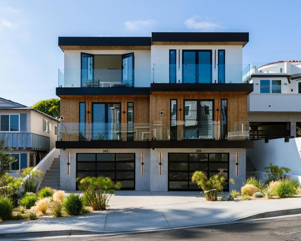 Steps from iconic Windansea Beach, in the highly sought after Beach Barber tract neighborhood, this brand-new custom-built masterpiece blends modern luxury with timeless coastal charm. The main residence offers 4 spacious bedrooms and 4.5 impeccably designed baths, paired with a fully detached 1 bed, 1 bath ADU — ideal for guests, extended family, or flexible rental opportunities. From the moment you enter, you're greeted with soaring ceilings, natural light pouring through expansive windows, and wide-plank white oak flooring that runs throughout. The open-concept living spaces are anchored by stunning custom cabinetry and designer finishes, creating a sophisticated yet relaxed coastal ambiance. The showstopping ocean-view primary suite features panoramic vistas, a spa-inspired bath with soaking tub and walk-in shower, and a generous custom walk-in closet. Retreat upstairs to the expansive roof deck to soak in spectacular whitewater views — perfect for sunset entertaining or quiet moments above the surf. Additional highlights include a 2+ car garage, ample storage for surfboards, beach gear, and bikes, paid solar, custom sound and lighting systems, and seamless indoor-outdoor flow for the ultimate Southern California lifestyle. A rare opportunity to own an architecturally distinct, thoughtfully crafted home just moments from one of La Jolla’s most treasured beaches.