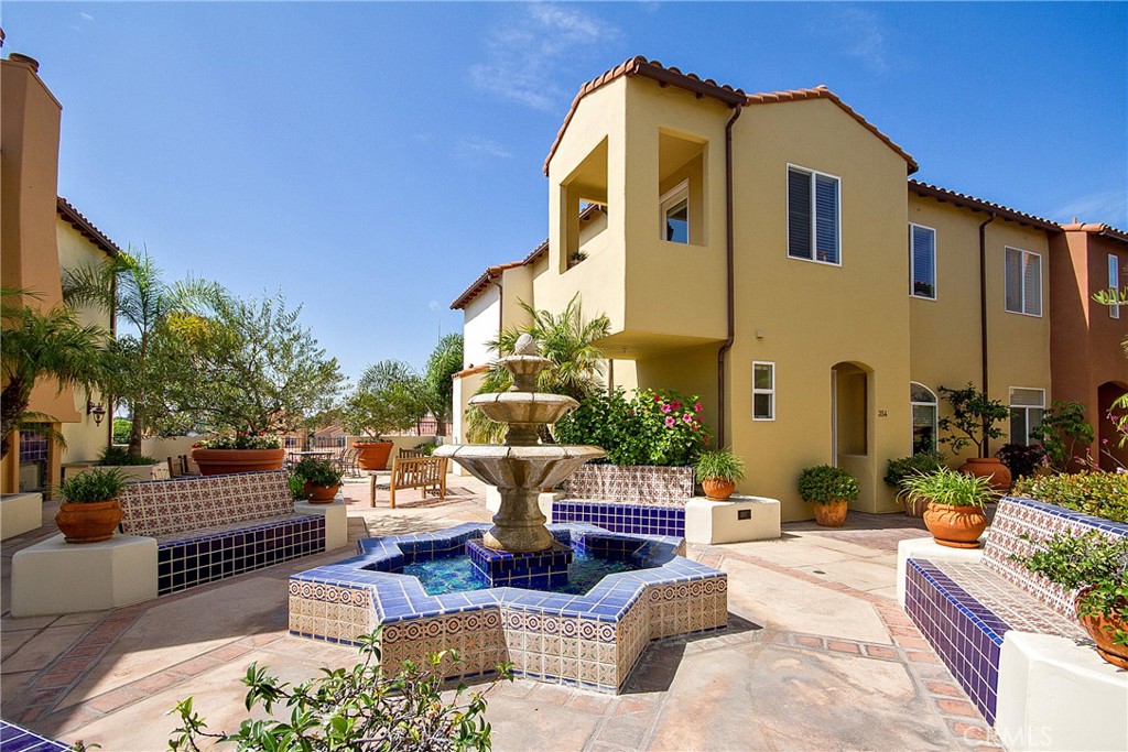 Here’s your updated listing description with the detail about the sinks clarified:
---
Experience luxury coastal living in the heart of Huntington Beach at Plaza Almeria, ideally situated just two blocks from the iconic pier and a short elevator ride to Main Street’s vibrant shops and restaurants. This beautifully maintained 2-bedroom, 2.5-bath end unit also includes a versatile bonus room, perfect for a home office or den. The spacious living room features warm wood flooring, a cozy gas fireplace, and multiple seating areas ideal for entertaining or relaxing after a day at the beach. The well-appointed kitchen, also finished with wood floors, includes appliances, a full-size refrigerator, ample cabinetry, and opens to a private patio—perfect for indoor-outdoor dining. The adjacent dining area comfortably seats eight guests.
Upstairs, you'll find two generously sized bedrooms, each with its own ensuite bathroom. The primary suite boasts a large walk-in closet, a dual-sink vanity, a separate soaking tub and shower, and a private water closet. The secondary bedroom includes a wall closet and an ensuite bath with a single-sink vanity and a step-in shower. Both bedrooms, along with the upstairs hallway and staircase, are finished with brand-new plush carpeting and upgraded padding.
Additional highlights include an upstairs laundry room with a washer and dryer, a guest powder room on the main floor, two dedicated parking spaces in the secured garage, and a private storage closet. Plaza Almeria is a gated community with charming Spanish-style architecture and offers unparalleled access to the beach, Pacific City, and year-round events at the pier. Whether you're looking for a primary residence or a beachside retreat, this turnkey home offers the best of coastal Orange County living.