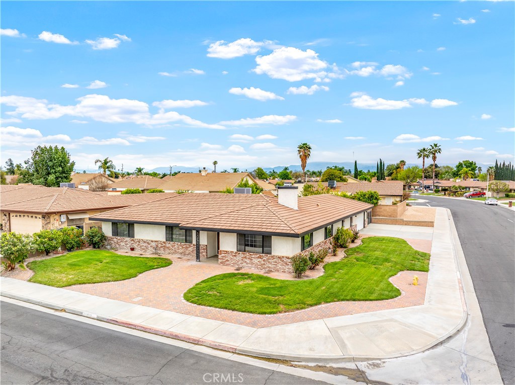 Beautifully Upgraded Home on Peaceful Cul-de-Sac Corner Lot
Tucked away on a quiet cul-de-sac corner lot, this beautifully upgraded home offers 2,280 sq. ft. of well-designed living space and is truly a standout. Recently refreshed with new carpet (installed 12/2024), fresh interior paint, and all-new stainless steel kitchen appliances—including a double oven perfect for the gourmet chef—this home is move-in ready.
Inside, you'll find two spacious living areas filled with natural light, framed by elegant plantation shutters and connected by a unique double-sided fireplace—ideal for cozy gatherings with family and friends. The kitchen shines with a generous breakfast bar and an inviting dining area, making it the heart of the home.
The oversized primary suite features a roomy ensuite bath with dual sinks and plenty of counter space. Two additional bedrooms are generously sized and include mirrored closet doors, offering both comfort and privacy.
A large laundry/utility room includes a built-in desk and ample storage, easily doubling as a home office.
Step outside and enjoy the Southern California lifestyle under a shaded patio with ceiling fan, surrounded by a lush lawn and a wide variety of mature fruit trees. Additional highlights include approximately 55 feet of gated RV parking with both electrical and water hookups—perfect for your adventure-ready lifestyle.