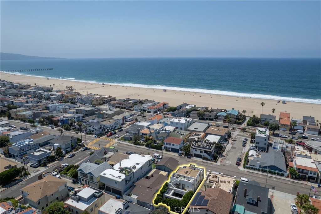 Welcome to 2540 Manhattan Ave, a true unicorn property perched in one of the most coveted pockets of Hermosa Beach. With panoramic, unobstructed views stretching from Catalina and Palos Verdes to the sparkling Queen’s Necklace and up to Malibu, this is coastal California living at its absolute finest. From your windows and rooftop decks, take in both the Manhattan and Hermosa Beach piers, mere moments away on foot, while the golden sand and ocean breeze are just steps from your door.
This stunning residence is an entertainer’s dream. The private backyard oasis features a full-size pool, sunken firepit lounge, integrated sound system, and an outdoor bar and kitchen that’s perfect for hosting unforgettable gatherings. Two expansive rooftop decks provide additional space to relax, entertain, or simply soak in the epic sunsets and coastal beauty that surrounds you.
Inside, this thoughtfully designed home offers a blend of luxury, comfort, and flexibility. A rare bonus: a fully separate 1-bedroom, 1-bath rental unit or guest house with its private entrance, ideal for visitors, in-laws, or additional income.
Whether you’re seeking the ultimate beach house, an entertainer’s haven, or an iconic investment, this is the opportunity of a lifetime. Properties like this don’t come around often, and once it’s gone, there’s no recreating it.