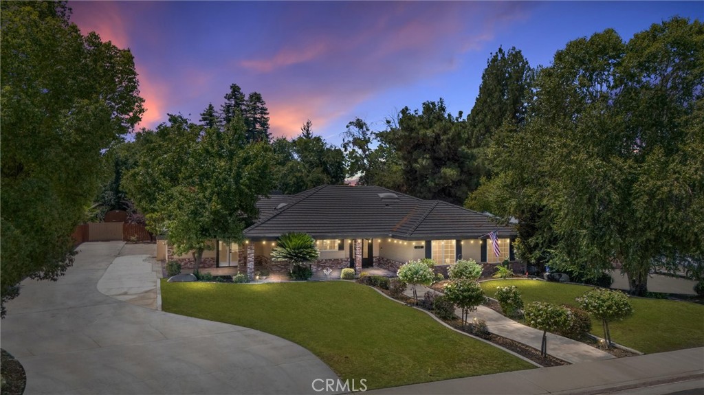 Stunning Custom Home in Northwest Bakersfield - This gorgeous 4 bedroom, 3 bathroom home sits on a spacious 0.51 acre lot and offers an abundance of high-end features and amenities. Enter through the impressive entryway with view of courtyard and pool. Vaulted ceilings lead into the open and airy living spaces. The large kitchen boasts beautiful granite countertops and ample cabinet space, perfect for the home chef. Entertain guests on the covered patio overlooking the sparkling in-ground pool and lush landscaping. Enjoy the luxury of a 3-car oversized garage with an additional bathroom and electric car charging, perfect for guests or a workshop. The home is also equipped with solar panels for extra energy savings. Other highlights include a putting green area, RV parking, and an extra long driveway with a storage shed. This northwest Bakersfield custom home is a must-see!