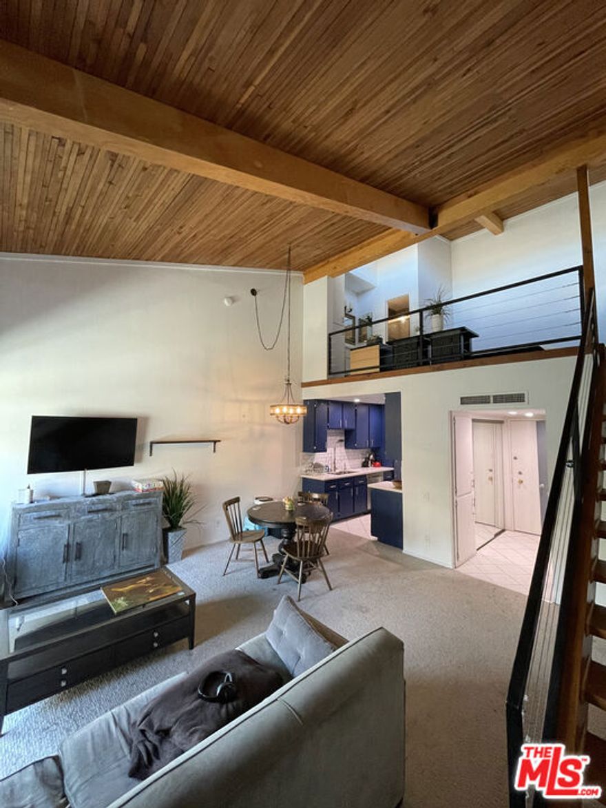Welcome to Encino Oaks and this Loft-Style one bedroom retreat! Soaring ceilings, abundant natural light, and an open floorplan create a bright and inviting living space. The loft bedroom offers privacy with its own en-suite bath, while convenient guest powder room sits on the main level. Enjoy fresh finishes, central air, and a private balcony overlooking the lush grounds.                                                                       *                                                                                                                                                                                        Encino Oaks delivers resort-style amenities including a pool, spa, fitness center, tennis courts, and clubhouse, all within a secure well-maintained community. Just minutes from Ventura Boulevard's dining, shopping, and easy freeway access, this home combines comfort, style, and convenience in the heart of Encino