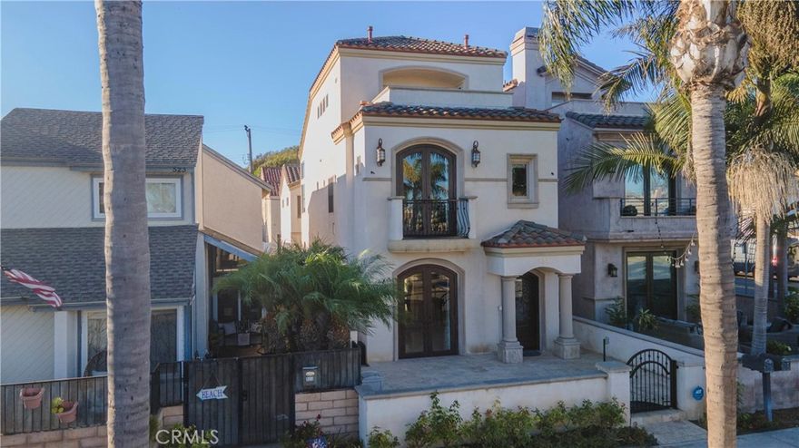 Welcome to this stunning custom Tuscan-style beach home located in the heart of downtown Huntington Beach — just 4 blocks from the sand and a short stroll to Main Street, the pier, shops, restaurants, and award-winning schools. This beautifully maintained residence offers approximately 2,875 sq ft of living space with 3 bedrooms, 3.5 bathrooms, and multiple bonus areas perfect for a home office, loft, or potential 4th bedroom. Enjoy high-end finishes throughout, including solid core doors, dual-pane low-e windows, three fireplaces, and a gourmet kitchen equipped with Thermador appliances, custom cabinetry, a large island, and stone countertops. The spacious primary suite features a luxurious en-suite bath, walk-in closet, and a private balcony. Multiple outdoor spaces include a front patio, interior courtyard, and rooftop deck — ideal for entertaining or relaxing in the coastal breeze. Additional highlights: custom entry door, recessed lighting, inside laundry, a wine cellar and a 2-car attached garage with alley access. Experience upscale beach living in one of Huntington Beach’s most desirable neighborhoods. No HOA. Don’t miss this rare opportunity which can be rented with or without the furniture.