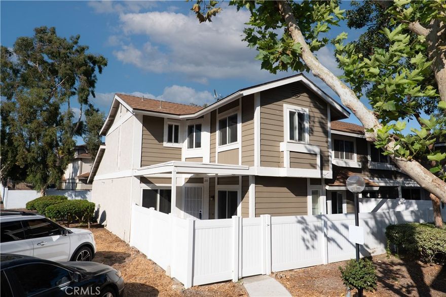 Turn-key and tastefully refreshed corner condo located in the heart of Ontario. Minutes from dining, entertainment, travel and more! Relax and unwind in this charming gated neighborhood. Step into a warm and inviting home with a beautiful new kitchen, quartz countertops, luxurious herringbone backsplash and over-sized sink - not to mention brand-new appliances. Imagine a cozy, built-in seating nook in the formal dining room and space for a sectional sofa in the living room. The new waterproof vinyl planks continue up the staircase to the guest and primary bedrooms. Enjoy green nature views from the guest bedroom and natural lighting from the newer windows. There are two separate bathroom sinks upstairs with one that is exclusive to the primary suite. Envision a full bedroom set in the primary room with extra space for a desk to work from home. Now say it with me: walk-in closet! Yes! This spacious home offers ample storage throughout and even more possibilities in the private attached 2-car garage. Note the upgrades yourself, come tour today!