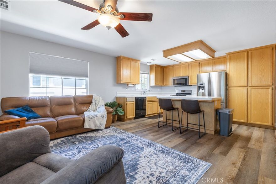 Welcome home! This charming 1,500± sq ft residence offers 3 bedrooms and 2.5 bathrooms in a desirable location within the community. Veterans—don’t miss the chance to assume the existing low 2.5% interest rate loan! Priced at an entry level for this area, opportunities like this are few and far between. Inside, the light-filled kitchen opens to the inviting family room, where a sliding glass door leads to your private balcony—perfect for morning coffee or evening relaxation. Stylish vinyl plank flooring adds warmth and elegance while being ideal for everyday living. The community offers well-kept common areas and a children’s playground/park for residents to enjoy. Set your Viewing appointment today!