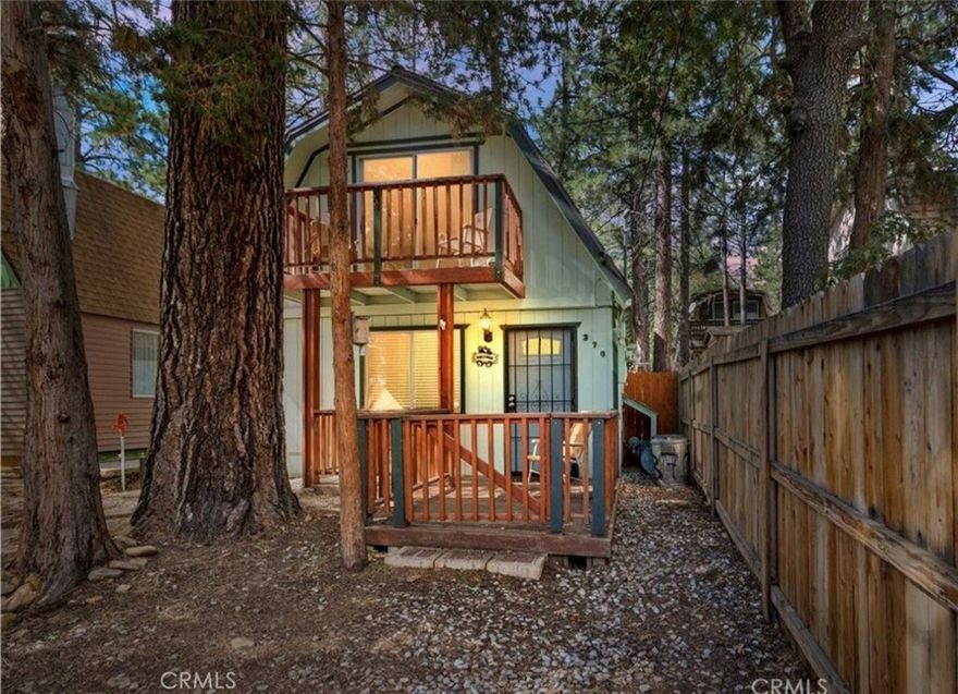 Welcome to your perfect mountain escape! This beautifully maintained two-story cabin offers stunning forest views and all the comforts of home. Featuring an open floor plan with a cozy yet spacious layout, the cabin includes one bedroom on the main level and a large upstairs loft currently configured as two additional sleeping areas. Step outside and breathe in the fresh mountain air from either the inviting front deck or the upper balcony—ideal spots for morning coffee or evening relaxation. Situated on a level lot with convenient parking, this retreat is perfectly located near Big Bear Lake, Snow Summit Ski Resort, hiking trails, shopping, and more. Whether you're looking for a serene getaway, a second home, or a fantastic investment property, this charming cabin offers endless possibilities and year-round enjoyment.