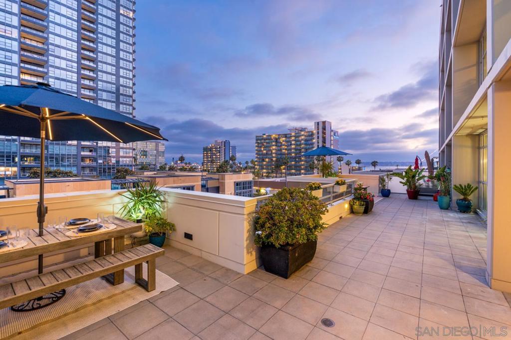 Live the ultimate indoor/outdoor lifestyle in this stunning two-story condo at Breeza, located in the heart of one of San Diego’s most desirable neighborhoods—Little Italy! This bright 2 bed, 2.5 bath home features floor-to-ceiling windows, wood flooring, and a spacious kitchen with abundant storage and a gas range. What truly sets this home apart is its rare double patio, including an expansive 800+ sq. ft. private terrace with breathtaking views of the bay, city skyline, historic Santa Fe Depot, and the iconic Star of India—perfect for enjoying San Diego’s weather, al fresco dining, and entertaining. There is truly nothing else like it in all of downtown. Inside, enjoy new custom storage throughout and modern window treatments that enhance both style and comfort. Both bedrooms offer custom closets, floor-to-ceiling views, and a stylish primary ensuite with a subway-tiled shower. Additional features include two side-by-side parking spaces and in-unit laundry. Breeza is a rare midrise community offering resort-style amenities: a year-round heated pool, spa, fitness center, EV charging, clubhouse, and an 8th-floor rooftop deck with panoramic bay and park views. The building is impeccably maintained with on-site management and weekly community socials. Enjoy seamless access to Little Italy’s farmers market, top dining, Waterfront Park, boutiques, and more—just minutes from Seaport Village, Petco Park, and The Rady Shell.