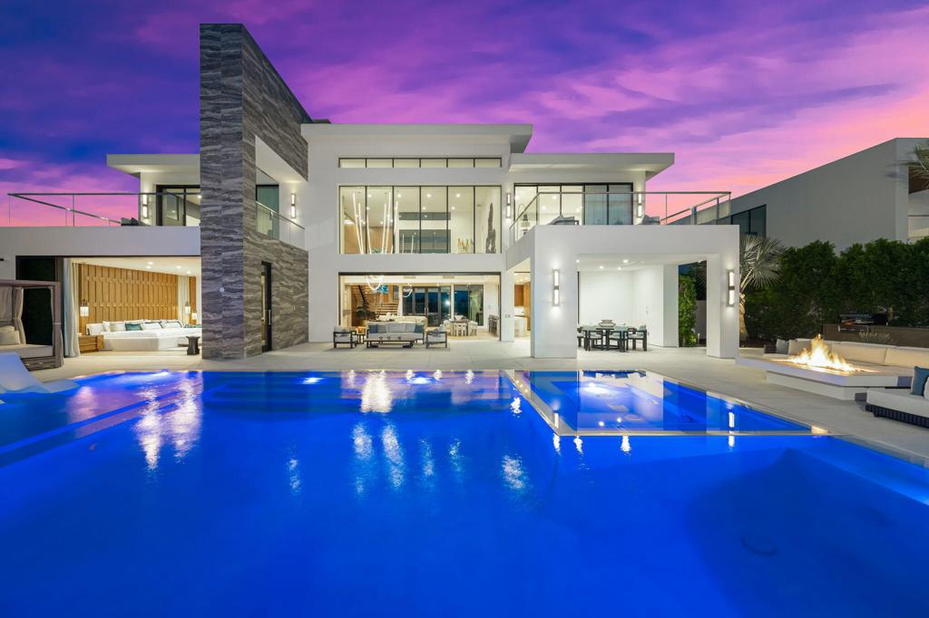 This is a One-Of-A-Kind Opportunity to own your piece of paradise at The Madison Club! This stunning newly-built custom home overlooks the 11th hole of the acclaimed Tom Fazio-designed golf course and features breathtaking western views of the Santa Rosa Mountains. Custom details throughout this 4 bedroom, 4 1/2 bath 6,169 sf home make it truly unique. The great room with soaring ceilings, distinctive wall finishes, abundant natural light, and a stunning light sculpture as the centerpiece, opens to the outdoor living and dining spaces. A large fire pit with ample seating, infinity edge pool and spa and BBQ island complete the outdoor entertaining space. No detail has been overlooked in any bedroom as each capitalizes on the view while providing a tranquil space to relax. The primary bedroom features a custom double king bed, fine wall finishes and an incredible spa-like bath. The light and bright downstairs guest suite may be accessed through primary room or hallway adding versatility for your family. Upstairs there are two spacious guest suites, each with an en-suite bath and private outdoor terrace, overlooking the pool and golf course. The kitchen is well appointed with top-of-the line appliances including a double Wolf range, large island with seating and custom wood countertop to match the beautiful, wood pantry and cabinets. This home is offered designer furnished including artwork. Membership is available and sold separately subject to Club approval