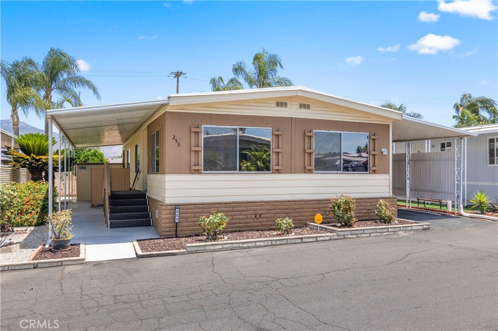 Welcome to your beautifully remodeled, Zen-like sanctuary in the desirable 55+ gated community of Casa Del Rey. This 1,200 sq ft, 2-bedroom, 2-bathroom manufactured home boasts an open floor plan and large, professionally tinted front windows that offer scenic mountain views and privacy. Significant recent upgrades ensure peace of mind and energy efficiency, including a new HVAC system installed in October 2024, a new gas water heater from March 2024, and a freshly resealed metal roof as of May 2024. The home features custom-built accessibility stairs, modern lighting, and a blend of laminate, vinyl, and carpet flooring. The kitchen is equipped with energy-efficient stainless-steel appliances, a breakfast bar, and custom-sealed countertops. Enjoy the tranquility of your surroundings with a private, low-maintenance yard featuring an irrigation system that was replaced 8/2024, citrus trees, and a covered patio perfect for taking in the stunning views. The unit will also be partially furnished for move-in convenience. This home offers ample storage, including two sheds and numerous built-in cabinets and closets. Residents of Casa Del Rey benefit from on-site management and a wide array of amenities, such as two clubhouses, two pools, jacuzzi, an exercise room, and a variety of social events. The community is conveniently located near a park, shopping, restaurants, and the Soboba Casino, with easy access to Palm Springs and Temecula.
