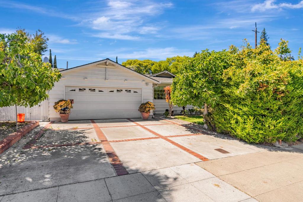 Welcome to a timeless mid-century gem situated in one of Palo Altos most desirable neighborhoods. This elegant single-story home showcases classic charm with modern updates, featuring rich hardwood flooring, crown molding, and statement crystal chandeliers that elevate each living space. The garage has been converted to additional living space without permits. The beautifully updated kitchen boasts granite countertops, custom cabinetry, and stainless steel appliances, with a casual dining nook and breakfast bar that flow seamlessly into the main living and entertaining areas. A spacious formal dining room sits adjacent to the main living area, both designed for comfortable hosting and everyday living. Sliding glass doors open to a meticulously maintained backyard oasis, where mature fruit trees, flowering shrubs, and a charming arbor create a private retreat. The expansive deck with built-in seating and shaded lounging area invites relaxed outdoor living. This home offers easy access to top-rated Palo Alto schools, nearby parks, shopping, and major Silicon Valley employers. A blend of Classic sophistication and beautifully curated outdoor spaces, this is a rare opportunity to own a move-in ready property in the heart of Palo Alto.