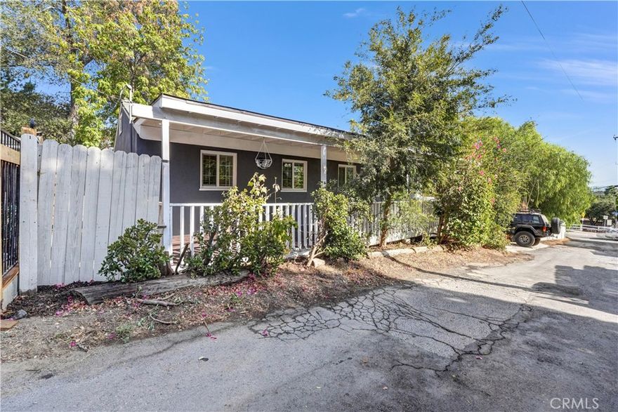 Discover this rare opportunity to own a inviting 2-Bedroom + 1-Bath Home in Picturesque Lake Manor area of Chatsworth  just minutes West of Topanga Canyon Blvd. 
This delightful home features a Very Large Front Porch with on a Private Street, Wood Deck in the back Yard with Plenty of Room for an RV, Boats, Work Trucks or Recreational Equipment.  The low-maintenance landscaping provides added flexibility for potential expansion or the addition of an ADU.
The Updated Interior Showcases New Wood-Style Vinyl Flooring, Newer Dual Payne Windows, Copper Plumbing ,Fresh Paint Inside and Out, Mirrored Closet Doors, and a Laundry Area inside the Home.
Step Outside and enjoy the Breathtaking Views and the Small Town Neighborhood that create a Very Special Country Lifestyle. There is a Community Convenience  Store just a 2 minute walk. Lots of Walking and Hiking Trails.....
Come home to this Peaceful Updated Gem tucked away, yet only a few minutes from Central Chatsworth, West Hills, Woodland Hills, and Old Town Calabasas. Conveniently located near grocery stores such as Ralphs, Trader Joe's, Whole Foods, and Bristol Farms, as well as nearby Hwy 118 and Hwy 101. This property offers a blend of country living with convenient city access.