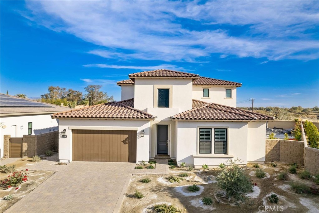 Fully furnished newly built home in the prestigious gated community of Stone Creek Ranch. This model home comes furnished and features 5 bedrooms, 5 bathrooms, office and theater room. The master bedroom is located on the first floor with a luxurious master bathroom with a soaking tub with an oversize shower. The living and Dining room boast over 20 ft ceilings with wood floors and sliding doors leading to the amazing entertainer's yard with a saltwater pool and spa, built-in bbq grill and outdoor fireplace with spectacular views of Coral Mountain. This home is just a few minutes to PGA West and Greg Norman public courses, and Coachella and Stagecoach festivals.
