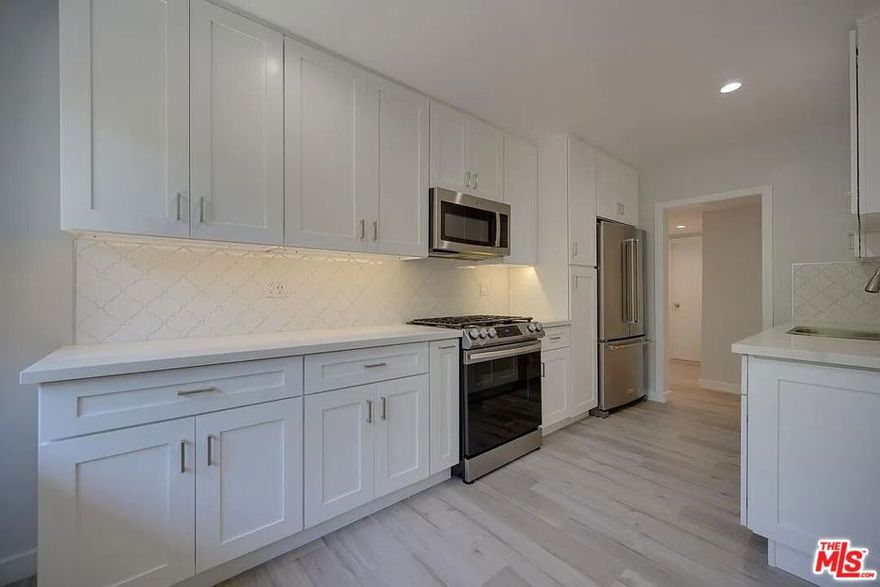 Just Renovated West Hollywood 3 bed / 2 bath Apartment -  Euro Kitchen, W/D In-Unit, Condo-Quality Finishes. Live in the heart of West Hollywood in this beautifully renovated, condo-spec apartment with elevated finishes throughout. From the new hardwood floors to the custom tiled bathrooms and LED lighting, every detail was thoughtfully upgraded for a sleek, modern feel. Highlights - newly renovated - New hardwood flooring- European-style kitchen- High-end appliances- Washer/Dryer in unit - Custom tiled bathrooms - LED lighting throughout - Built to condo specifications - Unbeatable WeHo Location - Step outside and you're moments from the best of the neighborhood shops, dining, Melrose Place, Beverly Center, Third Street, and more. Truly a walkable location where you'll want to leave the car at home. Building FeaturesSecure access buildingSituated on a quiet, lovely neighborhood street. Lease Details - Available Jan 1st. 2 tandem parking spots and free street parking. Owner pays: hot & cold water, trash, and gardener