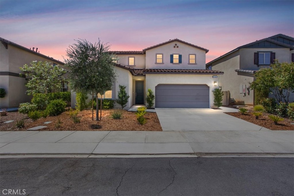 Welcome to this beautifully upgraded 2-story home in the sought-after Atwell community. Built in 2020, this spacious residence offers 3–4 bedrooms, 2.5 bathrooms, and thoughtful upgrades throughout. Step inside to find open-concept living with upgraded flooring, custom baseboards, framed mirrors, window sills, and a stylish kitchen backsplash. The downstairs office includes a custom doorway, making it ideal for working from home. Tech-savvy buyers will appreciate whole-home Cat5 wiring with dual Cat5 in one room, cordless TV wall mount, and additional dimmer lighting in the kitchen. Upstairs, the primary suite features a walk-in closet with a full mirrored door. The home also includes five ceiling fans, upgraded toilets, blinds, and custom curtains. A new A/C unit ensures year-round comfort. The backyard is perfect for entertaining with a patio cover, extended concrete slab, custom retaining wall with planters, sprinkler system, and mature landscaping. Enjoy your own mini orchard with avocado, Meyer lemon, sweet orange, purple leaf plum, pistache, crepe myrtles, and more. Living in Atwell means access to resort-style amenities: multiple pools (including a lap pool), spas, clubhouse, BBQs, playgrounds, walking trails, and parks. Conveniently located minutes from shopping, dining, and the 10 Freeway, this home is both commuter-friendly and community-driven. Don’t miss your chance to own a move-in ready home with premium upgrades in one of the area’s most desirable neighborhoods!