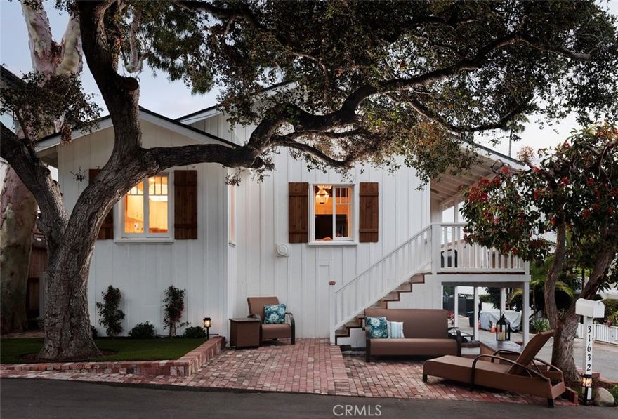 Step into a piece of Laguna Beach history with this quintessential 1930’s board-and-batten cottage, perfectly positioned in the heart of South Laguna. This two-bedroom, one-bath ocean view home is filled with character, natural light, and timeless details—all just a short stroll to Table Rock, Thousand Steps, and West Street beaches, as well as the world-class Montage Resort.



Inside, the home features a bright, airy kitchen, cozy living spaces, a grand wood burning fireplace and a loft offering additional room for guests, a Sunday nap, or creative retreat. Every room is framed by windows that bring the coastal views and ocean breezes indoors. A convenient one-car garage adds valuable parking and storage—an uncommon find in this beach-close location.



Multiple outdoor spaces set the stage for relaxed entertaining and everyday enjoyment. Gather on the wide front porch, shaded by mature trees, host friends on the private patios, or take in sunsets from the elevated deck.



This property offers flexibility for every lifestyle—whether as a full-time residence, a beach escape, or an investment opportunity. With room to expand, the existing footprint provides an ideal opportunity to add an income-producing ADU.



Enjoy everything Laguna has to offer right outside your door—local restaurants, coastal trails, and the trolley that connects you to the vibrant energy of downtown.



This is a rare opportunity to own an authentic piece of Laguna Beach history where charm, character, and opportunity meet the California coast. Exclusive viewing by appointment only.