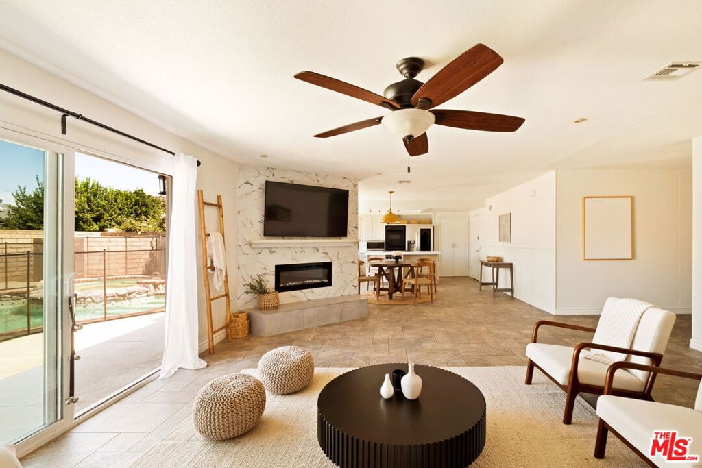 Take advantage of an extremely rare financing opportunity with this charming 4 bedroom, 2 bathroom home, offering 1,780 sqft of comfortable living space. The spacious layout features a welcoming open-concept living room that flows directly into the dining and kitchen area with a cozy fireplace anchoring the space, all staring out to the beautiful backyard through double sliding glass doors. It's the ideal setting for gatherings and everyday living. The backyard is a knockout feature of the home, designed for relaxation and entertaining with low-maintenance turf and a gated in-ground pool and jacuzzi. Additional features include an epoxy-finished garage and an ideal location just steps from Crestview Elementary, one block from Hillside Middle School, and close to Sycamore Park. Residents will also enjoy easy access to Simi Valley's popular shopping centers, local restaurants, and scenic hiking trails including Corriganville Park, Hummingbird Trail, and Mount McCoy offering the perfect balance of convenience, recreation, and outdoor adventure. With its prime setting, generous floor plan, and the incredible advantage of an assumable VA mortgage at only 4.25%, this home presents outstanding value in today's market and will not last! Assumption of the VA loan is subject to lender approval, buyer eligibility, and all applicable terms and conditions.