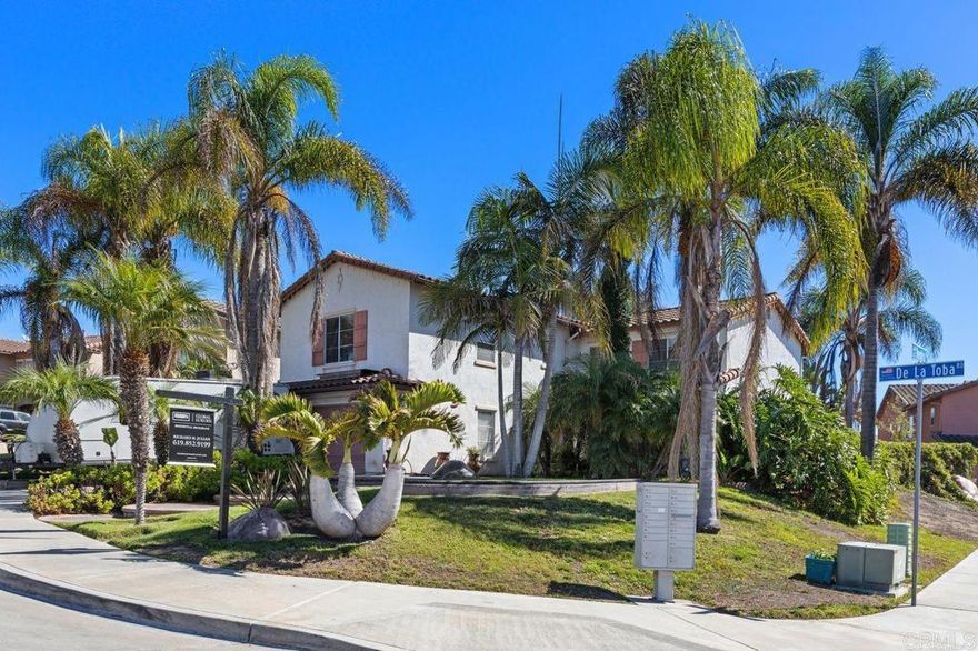 An exceptional find in a prestigious neighborhood, this four-bedroom, two-and-a-half-bath home combines inviting warmth, tropical tranquility, and unbeatable value—without the burden of HOA fees. Situated on a desirable corner lot, the residence is surrounded by lush, mature landscaping that creates a sense of privacy and everyday retreat. Step inside to discover an open and light-filled floor plan featuring warm hardwood floors, a cozy fireplace, and an elegant flow ideal for both relaxing and entertaining. The kitchen offers generous cabinetry and prep space, blending practicality with timeless charm. The primary suite serves as a peaceful sanctuary with serene garden views and ceiling-fan comfort, while three additional bedrooms provide flexibility for guests, home offices, or creative pursuits. Outdoors, enjoy your private backyard oasis framed by vibrant tropical greenery—perfect for quiet mornings, weekend gatherings, or al fresco dining under the palms. This residence blends space, style, and sophistication in a premier location, representing an outstanding value in today’s market.