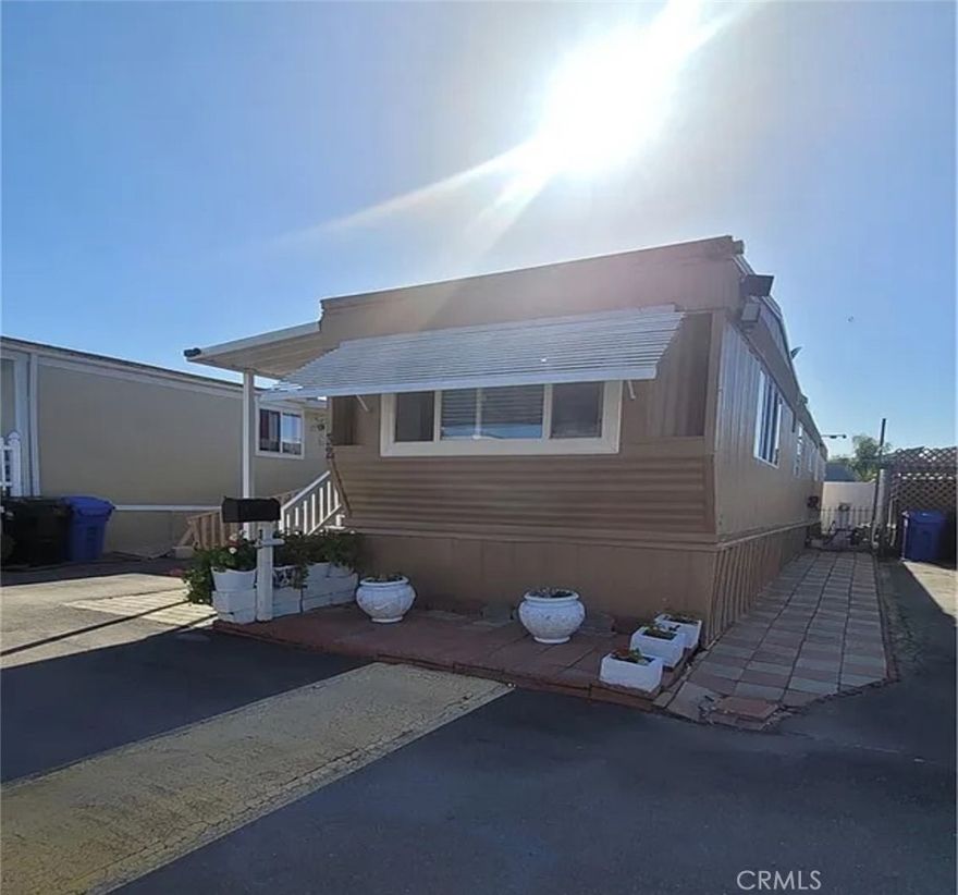 Welcome to this charming and well-maintained mobile home nestled in a peaceful community in the heart of Torrance. This cozy residence offers a perfect blend of comfort and convenience, featuring a bright and inviting interior with a spacious living area ideal for relaxing or entertaining. The kitchen is equipped with ample cabinetry and counter space, providing functionality for daily living or weekend gatherings. Natural light fills the home, enhancing the warm atmosphere throughout. The outdoor space includes a private patio area perfect for enjoying the Southern California weather, along with dedicated parking. Located within a well-kept park, residents enjoy access to community amenities and the benefits of being close to local shopping, dining, schools, and major freeways. This home presents a great opportunity for those seeking an affordable lifestyle in a desirable South Bay location.