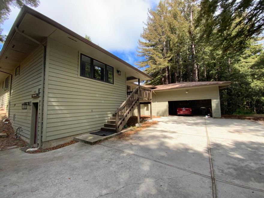 First time on the market in over 60 years, this approximately 30 acre property is subdivided at the county level into three approximately 10 acre parcels with a home on the middle parcel. Located in the hills above the charming town of Aptos, this lovely property is adjacent to the Forest of Nicene Marks.   The spacious 2,375 sq.ft. all electric home has four bedrooms and two and a half baths, including an en-suite. The well-equipped eat-in kitchen features modern appliances and granite countertops, with an induction cooktop, wall oven, microwave, dishwasher, and refrigerator. There is a fireplace in the living room/dining room and in the family room, which includes a wet bar with under cabinet refrigerator. Laminate and tile flooring throughout, except in the attached solarium, which has concrete floors. Separate utility room with washer/dryer hookups connects to the oversized garage. Behind the garage is an attached workshop. There is also a half-basement.   Situated within the Pajaro Valley Unified School District, this property is perfect for families. Don't miss this opportunity to make this Aptos home your own.
