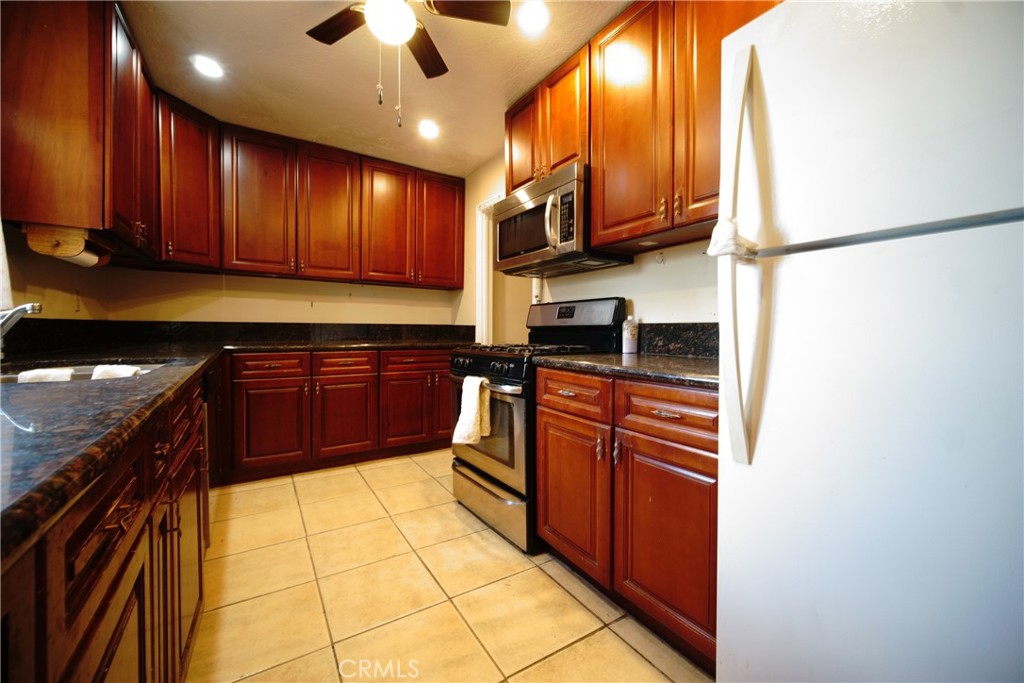 Here's the deal!
A 3-bedroom 1 bath older home with new kitchen, jacuzzi tub, split system and evaporative cooling. Has a 5th wheel trailer in the very private back yard that owner used as a woodworking shop but can be easily turned back up into a guest room.
yard has been separated into 3 areas for fruit trees, dog runs, etc. includes Meyer lemon, lime, grapefruit, tangelo and peach trees!