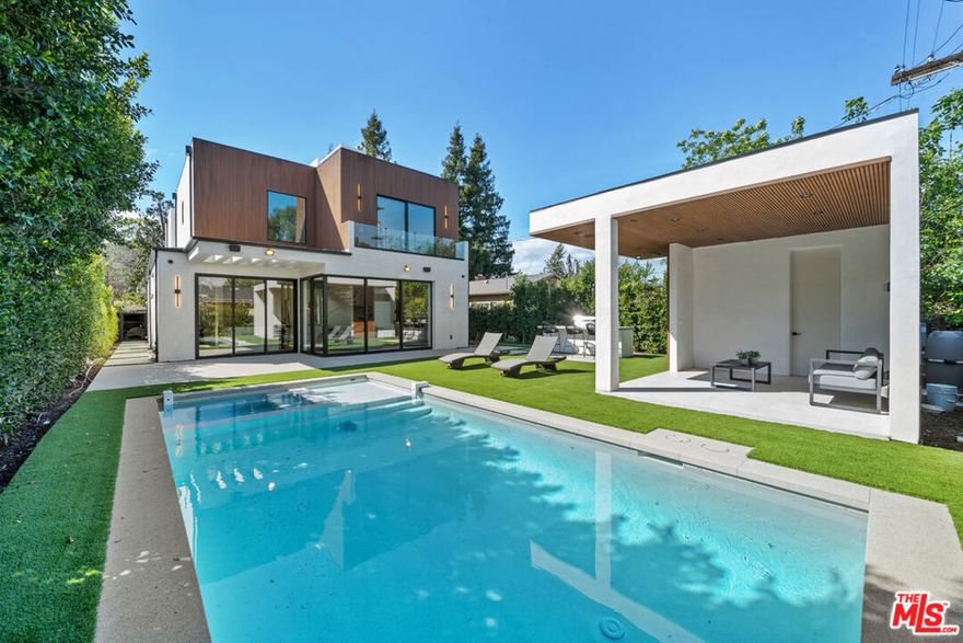 Stunning 2023 Modern Smart Home in Sherman OaksExceptional new construction featuring 4 bedrooms, 5.5 baths, office, and dramatic floating glass staircase. Light-filled interiors with floor-to-ceiling windows and sliding glass doors blend seamlessly with a private outdoor oasispool, cabana, outdoor kitchen, and patio.Chef's kitchen with high-end appliances, stone counters, and island opens to a spacious family room with fireplace. Formal dining room for elegant entertaining. Downstairs guest suite.Upstairs, primary retreat with balcony, custom walk-in, and spa bath. Two additional en-suites (one with balcony) plus upstairs laundry. Steps to Ventura Blvd's dining and shoppinga perfect blend of luxury, comfort, and location.