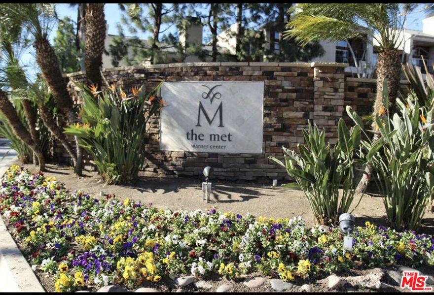 Experience the epitome of opulent living at The Met. This exquisite condo boasts two master bedrooms and a kitchen that's been lavishly upgraded with sleek granite countertops and top-of-the-line stainless steel appliances, complete with a washer and dryer for your convenience. The living room features a cozy fireplace, bathing the space in an abundance of natural light. Convenience is at your doorstep, as this residence is in proximity to high-end boutiques, gourmet restaurants, serene parks, lush golf courses, and charming sidewalk cafes. Nestled within a private gated community, The Met offers a wealth of amenities, including convenient elevators, four luxurious resort-style swimming pools, a rejuvenating spa, and six meticulously maintained lighted tennis courts. Stay in peak physical condition with access to a fitness center equipped with a sauna and cardio theater. For those who enjoy a bit of competition, there's a racquetball and basketball court at your disposal. Intimate courtyard gathering areas provide serene spaces to unwind, and you can rest easy knowing there are 24-hour security guards and gated access for your peace of mind. Stay connected with WiFi available in the common areas, rounding out the luxuries of living at The Met.