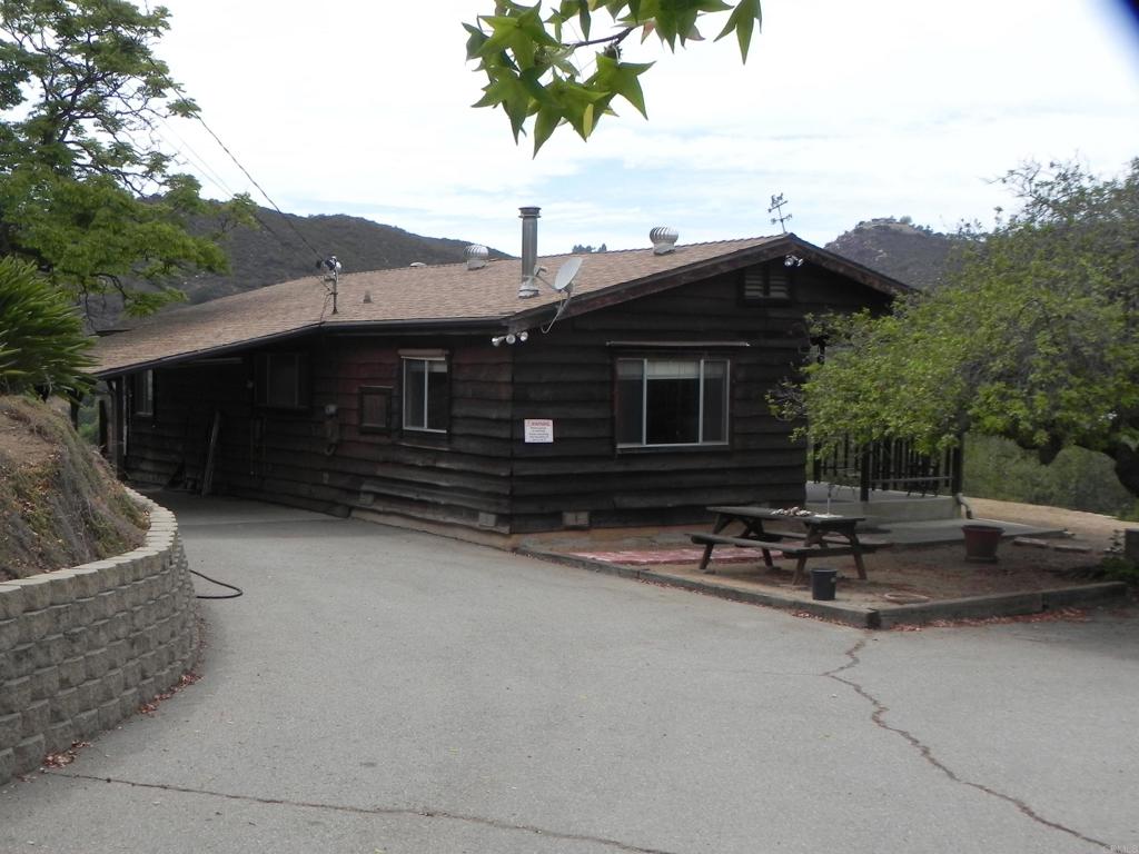 Opportunities can be yours on this 3 bedroom home sited on 1.45 acres. First time on the market in 54 years. Property boasts panoramic views of Harbison Canyon, large trees, room for RV, horses and garden areas. With two APN's that includes 4 subdivision parcels, this property screams for a future ADU or more. Make sure you check out the beautiful rockwork, block retaining walls and asphalted access roads throughout the property. Property has some differed maintenance and is in need of floor coverings, updated HVAC, deck repair and more.