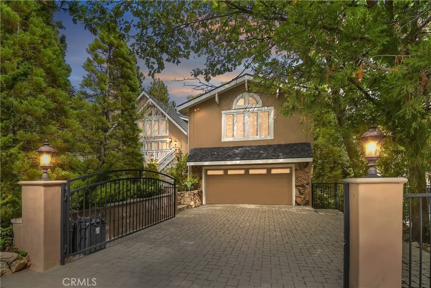 This is a really special home. It presents as an executive retreat with 3 bedrooms on the main level along with the large living room opening into dining area and kitchen. The beautiful stone fireplace spans floor to ceiling; it's not only a focal point, it's a spot to gather and sit by the fire for a cozy night staying in!!! Nice sized kitchen offers a breakfast bar,  built-in appliances and a  5-burner cooktop island.  Kitchen sink window overlooks back yard area and offers good lighting. Nice sized family room also on the main level features a bar, Swedish fireplace and plenty of room to relax, play your favorite game or binge on your fave TV shows. Upstairs is the private primary suite. Attached bath has a soaking tub and separate shower. Large walk-in closet. Gated driveway with level entry in to double garage. Private corner lot is nicely landscaped and fenced. Wide steps lead to front yard and formal entry. Nice warm ambiance is captured throughout this house. High ceilings and windows or sliding doors to the outside make it very light and airy. Beautiful light T&G ceilings and walls. Flooring is a mix of sea-grass carpeting and beautiful wood flooring.  Decks connect the house leading from the front door to the back yard area. Secluded rear deck is surrounded by lush landscaping and high decorative privacy fence. This property definitely feels like a sanctuary. Bonus room off the garage level has a door to the yard, great for a workshop or just storage for your outdoor furniture and/or lake toys. Gorgeous Lake Rights Home!!