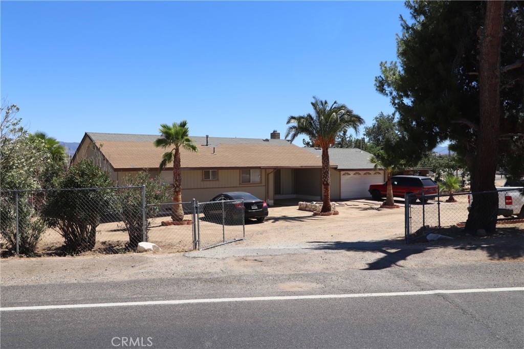 Hesperia offers great opportunity to own this large comfortable home on huge 20,000 sqft lot with RV access, circular driveway, low maintenance yards, and mature trees. Plenty of space to create your very own garden, workspace, playground, keep pets, etc. Indoors, home offers 3 bedrooms, 2 bathrooms, bonus room, lovely wood burning stove in living room which leads directly to dining area and kitchen. Whether you like entertaining or just want space and a great location, this home may be just what you're looking for.