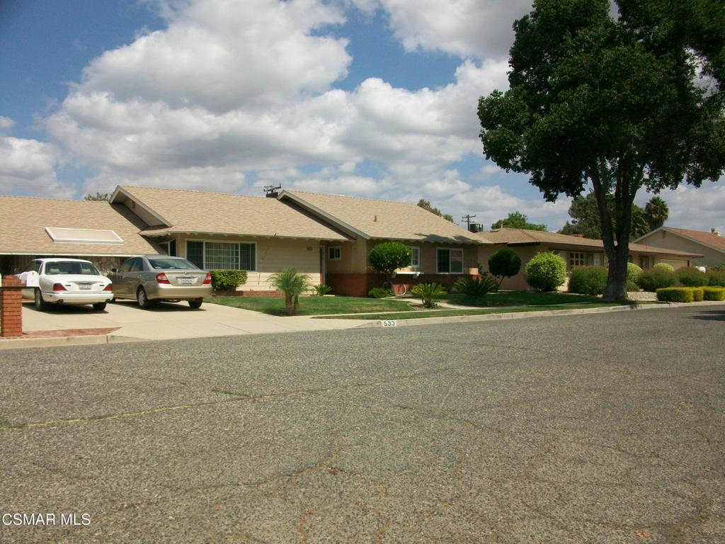 This stunning Tom Paul home is loaded with features. The 10,018 sq. ft. lot has 3 avocado, 1 orange, 1 lemon, and 1 tangerine tree. The back yard features a rolling wrought iron gate which gives access to two large out buildings with covered parking for at least three cars and is fully paved with concrete. The upper level is separately fenced and gated with a manicured lawn with automatic sprinklers. It also features a relaxing spa for those cool Simi Valley evenings. The home itself has a huge 25 X 17 living room with plenty of windows making it light and bright. The expansive family room with wood and gas burning fireplace has a great view of the back yard . The kitchen is very spacious with loads of cabinets, granite, and a garden window with a view. There also several ceiling fans, tons of linen storage, recessed lighting everywhere and of course central air and heat. Another great feature is the added laundry room with up graded electrical panel and again lots of added storage. The washer/ dryer/ and refrigerator are also included. This is a VIEW property
