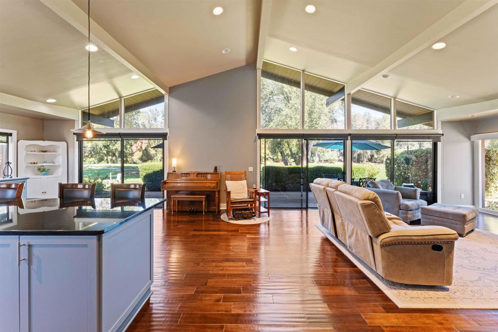 Variable Pricing $649,000-$680,000! PAID SOLAR and Assumable VA loan 1.75% interest, and you don't need to be a service member to take on this VA loan! AND talk about location! This single-story home is located on the 16th Fairway of the Pauma Valley Robert Trent Jones Jr Golf Course where you can enjoy your morning coffee while looking at Palomar Mountain. Tranquility meets comfort and seclusion situated at the end of a cul-de-sac while twenty-steps to the community heated salt-water pool. Beautiful wood floors. Each bedroom has a bathroom of its own. The current owner has transitioned the garage into a nautical themed game room which can easily be converted back. But there is no need, keep the extra square footage with tons of recreation. Courtyard has a private sitting area and the oversized back patio is perfect for entertaining. The courtyard and side yard are completely fenced for your small furry friend(s)!