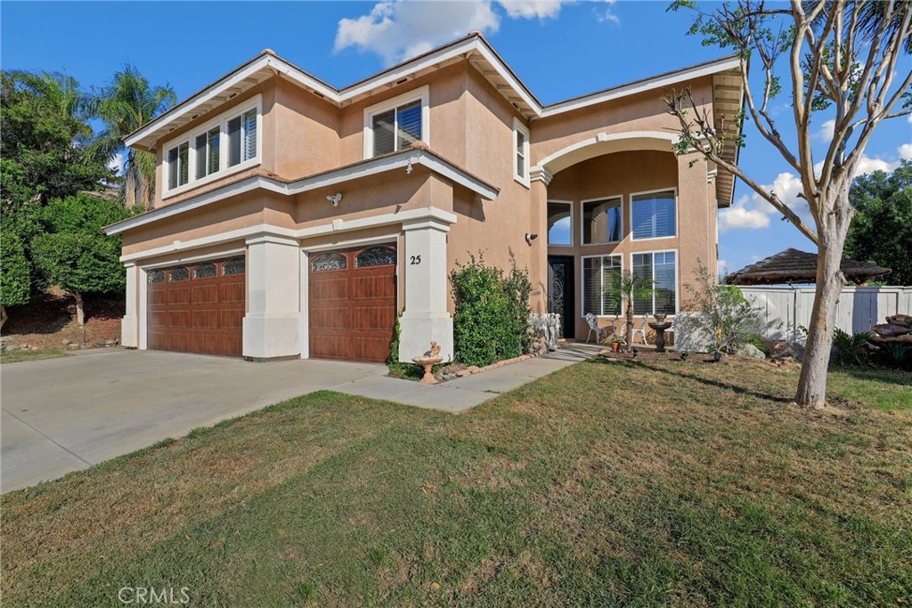 A Spectacular 5 BD/3 BA Oasis in the prestigious Tuscany Hills Community with Captivating Views! Discover your dream home where luxury living meets modern convenience. This stunning residence boasts a generous 0.33-acre lot and welcomes you with double iron front doors that open to a spacious and inviting living area, complete with soaring ceilings and elegant formal dining room. Relax and unwind in the family room, where a fireplace creates the perfect ambiance. Natural light bathes the open family room and chef's kitchen, which features top-of-the-line stainless steel appliances and an eat-in bar. For seamless indoor/outdoor entertaining, a large sliding glass door connects the family room to the entertainer's backyard. The primary suite is a true retreat, offering breathtaking views, a generously sized patio with a sliding glass door, and an ensuite spa-like bathroom with a soaking tub, double vanity, and a glass-enclosed shower. This home boasts an impressive array of upgrades and features, including fresh interior paint, copper repiping for the tankless water system, 18 Hanwha Q Solar Panels, a High-Efficiency Goodman Brand (18 SEER, 2-stage, 5-ton) HVAC system ensuring year-round air conditioning comfort, new grill vents for the AC, as well as Chilipepper Hot Water Recirculation Pump for rapid water heating, electrical setups for TV install in 4 spaces, upgraded mini blinds in 2 rooms, Schlage Alexandria knobs, adapter outlets with GFI, recessed lighting, a laundry room w/sink, balcony wood-tile floors, and a remodeled storage room! All bathrooms have also been updated w/new toilets and sensor lights, and the property is equipped with Ring cameras for added security! A paradise awaits outdoors, with fruit trees including; papaya, orange, apple, plum, tangerine, peach, pomegranate, avocado, & also blackberries! Enjoy the private Resort-like pool w/slide & Grotto w/built-in swim-up bar! This home also features a 3-car attached garage with Clopay Coachman Collection Garage Doors. The interior of the garage offers epoxy floors, and the property also has an extended driveway - great for ample parking & guests. Residents of Tuscany Hills can also enjoy access to the clubhouse, pool, spa, tennis courts, playground, beach volleyball court, basketball courts, rec rooms, gym, and so much more! Don't forget Low HOA fees, and don't miss out on this opportunity to own this remarkable property and call it home!
