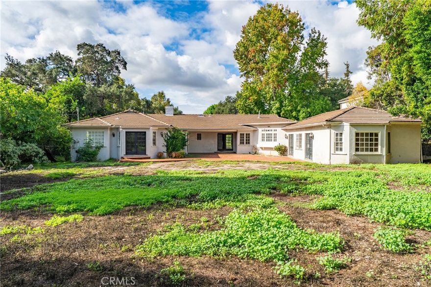 Located in the coveted Santa Anita Oaks, this almost 34,000 sq ft flat lot offers rare estate potential with mountain views, a pool, and mature trees. The 3,532 sq ft single-level home features spacious rooms, natural light, and classic details—ready for remodel, expansion, or a custom luxury rebuild. Close to schools, shops, and Santa Anita Park. A premier Arcadia opportunity. New roof (April 2024).