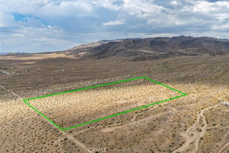 20 Acres of Desert Beauty — Minutes from The East Entrance of Joshua Tree National Park! 
Nestled just outside the desirable Hanson Tract housing community and only minutes from the Joshua Tree National Park East entrance, this expansive 20-acre parcel offers the perfect blend of peace, privacy, and possibility.
The current owner has thoughtfully added walking paths, a mini campsite area, and a drivable access road — making it easy to explore and envision your dream project. Electricity and water are both available on Baseline Road, just mins away, making access and future development a breeze. Whether you’re a builder, investor, or nature lover, this isn’t your average plot of land — it’s a desert sanctuary waiting to be brought to life.
Conveniently located just minutes from Baseline Road.
Endless potential for development or a private retreat.
Breathtaking views and serene desert surroundings.
A builder’s dream — come check it out today!
Address is for listing purposes. Please use Latitude and longitude to locate 34.112592, -116.015696
