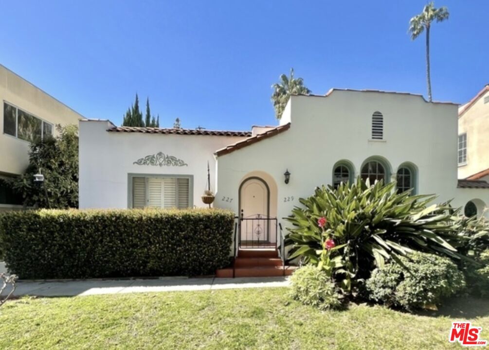 Discover this beautiful Spanish-style duplex located on one of Beverly Hills' most desirable and peaceful streets. Wide, tree-lined roads with minimal through-traffic create a quiet, neighborhood feel - while still being just moments from the city's best shopping, dining, and schools. Inside, the home features a traditional and inviting layout with spacious living areas, large bedrooms, and generous storage throughout. A versatile bonus room off the kitchen offers the perfect setup for a home office or study space. With plenty of natural light, in-unit washer and dryer, and the convenience of three dedicated parking spots, this residence balances charm with everyday practicality. Just a short stroll to the Beverly Center, within the Beverly Hills school district, and minutes from Rodeo Drive, this side-by-side duplex offers both comfort and convenience in an unbeatable location. Come experience the charm and make this Beverly Hills gem your new home! This unit will be available to lease Sept. 15.