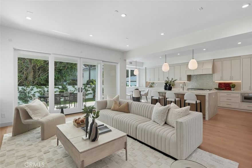 Welcome to this breathtaking new Modern beach home, where high-end finishes meet an open & bright floor plan in an A+ location. Nestled in the highly sought-after tree section, just a short stroll from the beach, parks, & Manhattan Village Mall with shops & eateries. As you step through the front door, you are greeted by an expansive open floor plan that seamlessly flows from the great room to the kitchen & family room to the spacious backyard with patio, making it an entertainer’s paradise. The inviting great room features custom built-in cabinetry, 2-story soaring ceiling, powder room, & main floor en-suite bedroom.  The Chef’s kitchen is a culinary dream, boasting an expansive porcelain center island with breakfast bar seating, top-of-the-line stainless-steel Thermador appliances including a 6-burner stove with griddle and double oven, 60” fridge & freezer, 24” wine tower fridge that holds approximately 92 bottles, microwave drawer, & rift oak soft closing cabinets & drawers. Off the kitchen is the family room with fireplace, built-in custom cabinetry, & wired for surround sound. From the family room you can access the turfed backyard & patio with tongue & groove wood ceiling, infrared ceiling heater, perfect for alfresco dining during any season. Upstairs, you will find four luxurious ensuite bedrooms and a well-appointed, big laundry room with deep sink, and custom cabinetry. The sun-drenched master suite features a vaulted tongue & groove wood & beam ceiling, sliding glass doors opening to a balcony, and a custom walk-in closet with built-in cabinetry. The spa-like master bathroom includes dual sinks, & a separate soaking tub, an oversized shower with 3 shower heads. Additional amenities include French white oak 9.5” wide plank flooring, 8-foot doors, dual zone A/C and heat, solar panels & back-up battery, central vacuum system, wired for data (Cat6), wired for sound, windows prewired for automatic window coverings, low maintenance landscaped front & backyard, epoxy garage floor, & car charger.