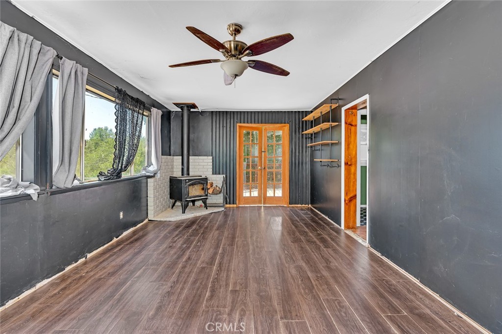 Welcome to 4162 Sullivan Rd, a unique gem tucked in the beautiful foothills of Mariposa. This inviting 2-bedroom, 1-bath home offers 924 sq ft of cozy, well-designed living space on a generously sized fenced lot—perfect for those seeking comfort, privacy, and room to grow. Step inside and enjoy the light-filled open floor plan, where the spacious living room flows seamlessly into the connected kitchen, creating the perfect environment for entertaining or quiet nights at home. Large shutter-style windows provide character and allow you to control natural light and airflow with ease, adding charm and functionality to every room.The outdoors is where this property truly shines. Enjoy your morning coffee or evening wine on the backyard patio deck, or host summer barbecues in the designated sitting areas surrounded by nature. The fenced yard offers a safe and secure space for pets and children to play freely, while a handy shed provides extra storage for tools, bikes, or hobbies. Whether you're an outdoor enthusiast or just love fresh air, you'll fall in love with the nearby hiking and biking trails that make every weekend an adventure. Imagine living where natural beauty meets daily convenience.This home is also a great choice for families, with schools nearby and a warm, small-town community vibe that makes Mariposa such a special place to call home. For investors, this property offers strong potential as a vacation rental, long-term rental, or second home due to its desirable location, low maintenance footprint, and proximity to Yosemite National Park.