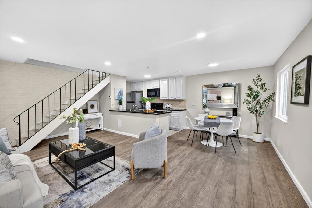 Welcome home to this beautifully refreshed 2-bedroom, 1-bath condo located in the highly desirable Hamilton Downs community within walking distance to Downtown Campbell. With modern updates, warm finishes, and an unbeatable location, this home blends comfort, style, and convenience. The open-concept living space showcases a kitchen with crisp light shaker cabinets, sleek black countertops, and upgraded appliances including brand new in-unit washer and dryer. Luxury vinyl flooring flows seamlessly throughout the living, dining, and kitchen areas, where large windows fill the space with natural light. Refreshed lighting adds a sophisticated touch in both the living area and bedrooms. Upstairs you'll find two bedrooms with generous windows, a full bath, and a washer and dryer for everyday convenience. Additional features include a dedicated carport with built-in storage cabinets. Just steps from Downtown Campbell, enjoy easy access to vibrant restaurants, coffee shops, wine bars, local boutiques, The Pruneyard, and the beloved Sunday farmers market. With close proximity to highways 17, 280, 880, and 85, commuting to leading tech employers such as Apple, Nvidia, and Adobe is effortless. Don't miss this opportunity to own in one of Campbells most walkable and connected neighborhoods.