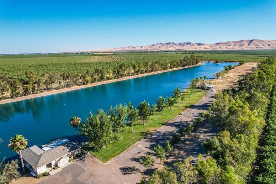 Nestled in a serene, private setting just 45 minutes east of San Francisco Bay Area, this expansive 20-acre parcel within a gated 40-acre ranch features a private and tranquil 14-acre water sports lake as its centerpiece.  An unparalleled opportunity to build your dream home(s) or multi-generational compound. This parcel is prepped for two residential lakefront homes/structures. Perfect for large families or investors seeking a unique destination. Enjoy endless activities such as waterskiing, wakeboarding, paddleboarding, tubing, cayaking & swimming right at your doorstep. The 30,000sf lakeside beach & grass area offers a blank canvas to develop additional leisure facilities or event spaces. Plenty of extra land to build your barn, pickleball court or orchard/vineyard. Additional amenities include a 600sf air-conditioned lakefront clubhouse, large boat dock with covered slip and hydraulic boat hoist, fully functioning domestic & agricultural well and 5400sf indoor storage facility with eight 14' high roll-up doors. This remarkable property provides the perfect balance of seclusion, adventure, and investment potential whether for family or a luxury corporate retreat.  Seller will also consider selling the entire 40 acres (two 20-acre parcels) allowing for a total of four home's.