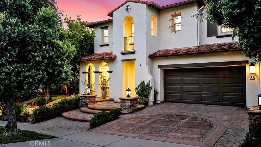 EXQUISITE DESIGNER VIEW HOME IN TALEGA’S GATED VITTORIA TRACT. Located in the prestigious gated community of Vittoria, this beautifully remodeled 3,370 sq ft home blends luxury, functionality, and panoramic hilltop views. With 4 bedrooms, 4 bathrooms, and a reimagined office, the layout is ideal for both everyday living and entertaining. Wide-plank oak flooring flows throughout the main level and continues into the upstairs loft and common areas, creating a seamless and sophisticated design. The office has been thoughtfully reconfigured with custom built-ins for added style and function. The open-concept kitchen and family room showcase a massive quartz center island, high-end appliances, under-window dining bench, and stunning views. A newly redesigned fireplace with custom tile and mantel anchors the family room. The formal living and dining room provide elegant entertaining space. A private downstairs bedroom is located just steps from a remodeled full bath featuring a new designer vanity and wallpaper. Upstairs, the spacious primary suite boasts a private balcony, spa-inspired bath with quartz counters, soaking tub, oversized shower, and dual closets—one with custom build-outs. Two additional en-suite bedrooms, a bonus room with built-in, and a stylish laundry room complete the second level. Additional upgrades include new wool carpet in bedrooms and stairs, custom closet build-outs, solid core two-panel doors with Emtek matte black hardware and upgraded 5½" to 6¼" baseboards and casings. Other features include plantation shutters, designer window treatments, crown molding, Nest thermostats, a built-in sound system, water softener, PEX piping, solar power, EV charger, and a redesigned driveway with room for a third car. The backyard offers incredible views, exterior lighting, drought-tolerant landscaping with drip irrigation, a built-in BBQ with bar seating, a covered dining area with heater and fan—perfect for enjoying SoCal evenings in style. This home is modern, move-in ready, and located in one of Talega’s most desirable neighborhoods. Talega amenities include pools, parks, sport courts, trails, and top-rated schools. Don’t miss this one-of-a-kind opportunity!