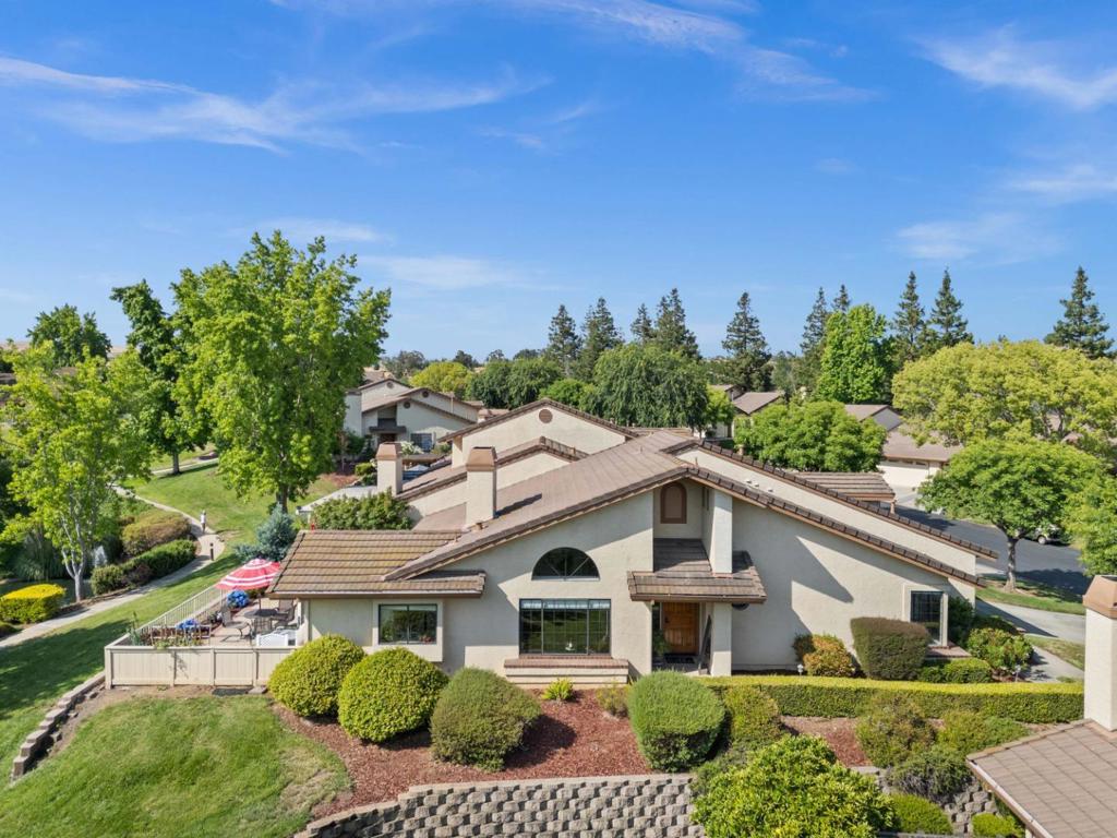 Picturesque Lake and fountains will be your view from this beautiful, fully remodeled condo. Situated in Del Lago Village inside the 55+ active adult community of The Villages Golf & Country Club. The Villages is one of the only 24/7 Guard gated communities in the Bay Area. This home is fully remodeled. The vaulted ceilings in the living room and dining area create a feeling of spaciousness. The home was extensively remodeled in 2019. The kitchen has granite counters, subway tile floors, induction range and a 6 month old refrigerator. The bathrooms are gorgeous. The master bathroom is very spacious with a large shower and double sinks. The floors were replaced with luxury vinyl. Even the Air conditioning unit and Furnace were replaced less than 1 year ago and the water heater was replaced 2 years ago. A sought after end unit, this home is surrounded by lawn and has a 4 car driveway. Located on a spacious lot, there is a lot of space between you and surrounding homes and the views are spectacular. The Villages is a very active adult community with four swimming pools + Spas, Pickle ball and tennis courts, two golf courses, Bocce, fitness center, hiking trails, horses and gardens plus 60+ clubs and events, with a formal restaurant in the club house and bistro. Adult fun.