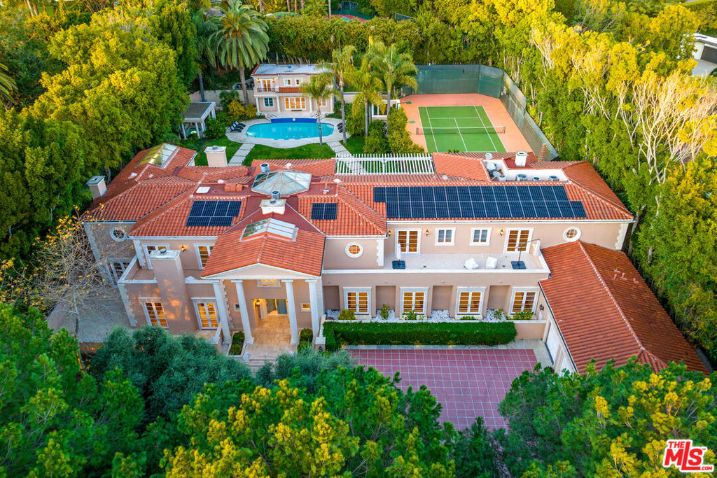 Don't miss the opportunity to own this dream property following a substantial price reduction. Welcome to luxury living at its finest in the coveted Trousdale community! This exquisite Mediterranean estate offers unparalleled elegance and privacy, with seller financing available for qualified buyers.Nestled on over an acre of meticulously manicured grounds, this gated masterpiece boasts partial city views and is just moments from the iconic Greystone Mansion. As one of the final two-story homes constructed in the area, it exudes timeless sophistication and charm.Upon entering, you'll be greeted by a grand foyer adorned with an opulent staircase illuminated by a captivating skylight and a European-imported chandelier worth over $500K. The main residence features an inviting library, a gourmet kitchen with top-tier stainless steel appliances, a climate-controlled wine cellar, and a spacious primary suite with dual bathrooms, walk-in closets, and a sauna.Enjoy seamless indoor-outdoor living with an elegant living room that opens to the lush backyard through refined French doors. Outside, entertain guests in style with a sparkling pool, tennis court, and professionally landscaped gardens. Security cameras and a surround sound system provide added peace of mind.Additionally, a 2-story, 2-bedroom guest house offers further accommodations and overlooks the main residence, completing this extraordinary estate.Experience the pinnacle of opulent living in this Mediterranean masterpiece, where luxury and tranquility await. Schedule your private tour today!