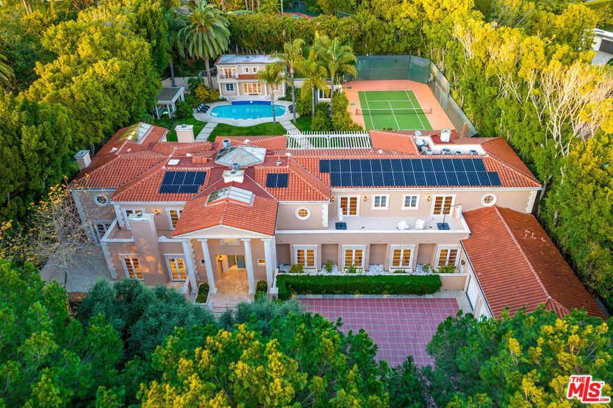 Don't miss the opportunity to own this dream property following a substantial price reduction. Welcome to luxury living at its finest in the coveted Trousdale community! This exquisite Mediterranean estate offers unparalleled elegance and privacy, with seller financing available for qualified buyers.Nestled on over an acre of meticulously manicured grounds, this gated masterpiece boasts partial city views and is just moments from the iconic Greystone Mansion. As one of the final two-story homes constructed in the area, it exudes timeless sophistication and charm.Upon entering, you'll be greeted by a grand foyer adorned with an opulent staircase illuminated by a captivating skylight and a European-imported chandelier worth over $500K. The main residence features an inviting library, a gourmet kitchen with top-tier stainless steel appliances, a climate-controlled wine cellar, and a spacious primary suite with dual bathrooms, walk-in closets, and a sauna.Enjoy seamless indoor-outdoor living with an elegant living room that opens to the lush backyard through refined French doors. Outside, entertain guests in style with a sparkling pool, tennis court, and professionally landscaped gardens. Security cameras and a surround sound system provide added peace of mind.Additionally, a 2-story, 2-bedroom guest house offers further accommodations and overlooks the main residence, completing this extraordinary estate.Experience the pinnacle of opulent living in this Mediterranean masterpiece, where luxury and tranquility await. Schedule your private tour today!