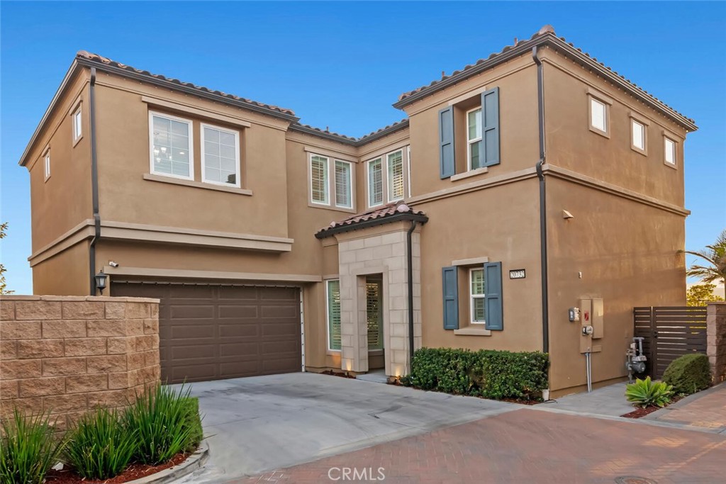 180 Degree VIEW Home in the prestigious Guard gated community of The Canyons. Experience luxury living in the most sought-after community of Porter Ranch with this beautifully upgraded 4-bedroom, 3-bath home situated on a premium view lot. Inside, enjoy an open-concept layout with a stunning quartz waterfall island, upgraded flooring throughout, and a resort-style master bath complemented by a custom walk-in closet. The home is further enhanced with a spacious loft, stainless steel appliances, washer and dryer conveniently located on the second floor, and custom-made high-quality shutters built throughout. Elegant lighting fixtures and well-kept landscaping add to the home’s appeal, while leased solar offers energy efficiency. The garage provides ample storage with built-in cabinets, and outside you’ll find a private entertainer’s paradise featuring a relaxing jacuzzi, cozy fire pit, and stylish seating areas—all set against breathtaking views. This home blends elegance, comfort, and modern upgrades, all within a community known for its family-friendly atmosphere and exceptional sense of community. Residents also enjoy resort-style amenities including a sparkling pool, spa, clubhouse, BBQ area, and splash pad all within a 24-hour guard-gated community. With top-rated schools, scenic trails, and easy freeway access nearby, this exceptional property offers luxury living at its finest.