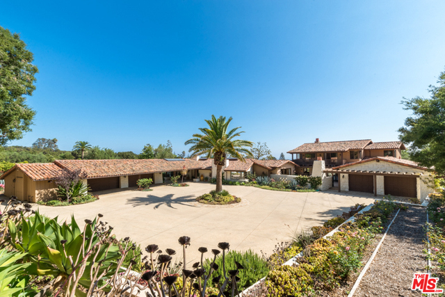 Sensational Cliff May architectural estate. Expansive, private & rare 4.25 flat and useable acreage w/ sweeping ocean and magical mountain views. Lovingly rebuilt/redefined while staying true to the original single level U shaped architecture. 7 bedrooms, 10 bathrooms. Indoor/outdoor flow from every room flooded w/ natural light. High ceilings, open beam skylights, Chefs kitchen, magnificent oxygenated pool, sport court. New onsite water well preserves lush orange orchards, expansive verdant lawns and mature landscaping. Separate guest house/maid quarters currently being used as a fully equipped gym & guest room. 6 car garage & room for large events, tennis court, equestrian etc. 2 APNs included in list price. An incomparable Estate!