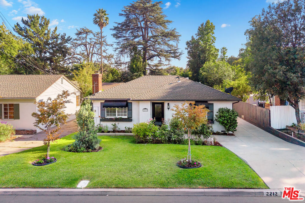 From the moment you arrive, this beautifully renovated home enchants with its storybook curb appeal and warm, cottage-inspired design. Thoughtfully updated to blend comfort with charm, it's the perfect retreat whether you're curling up with a book by the fire, soaking in the spa, or enjoying playtime in the expansive backyard.Inside the main house, you'll find two generous en suite bedroom side all for restful nights and peaceful privacy. Need space for guests or a home office? The detached backyard guest suite offers versatility and seclusion.The heart of the home is a whimsical kitchen with plenty of counter space and storage a dream for any cook or baker. Its open layout flows effortlessly into the living areas, inviting connection and togetherness, while the smart bedroom layout provides quiet separation when needed.Step outside to discover your own private oasis: a lush, flat backyard that's perfect for everything from outdoor movie nights and hammock lounging to games of croquet or volleyball. Whatever your lifestyle, this home is ready to bring it to life.